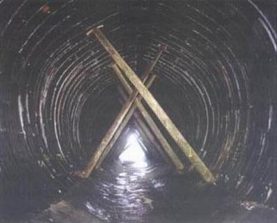 Props supported the liner plates of the old culverts.